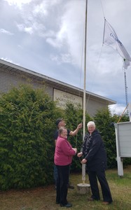 <strong>Community Living 2023</strong><br />2023 Mayor Giardini raising flag with Frances McCarthy